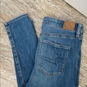 American Eagle next level stretch skinny Jeans - medium wash - size 8 long